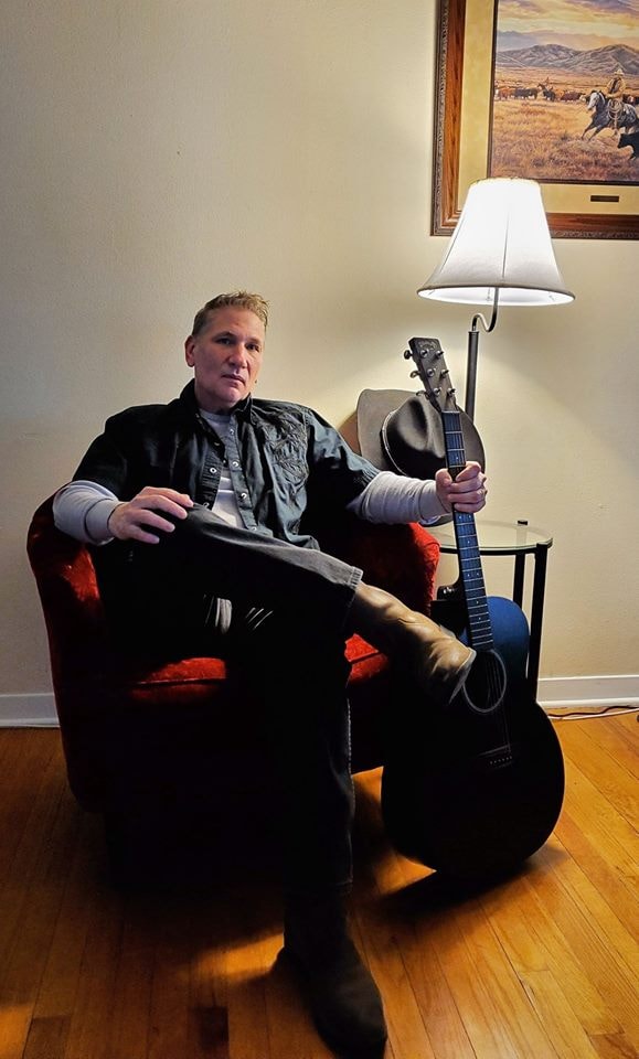 Mark Wayne Hagood with acoustic guitar